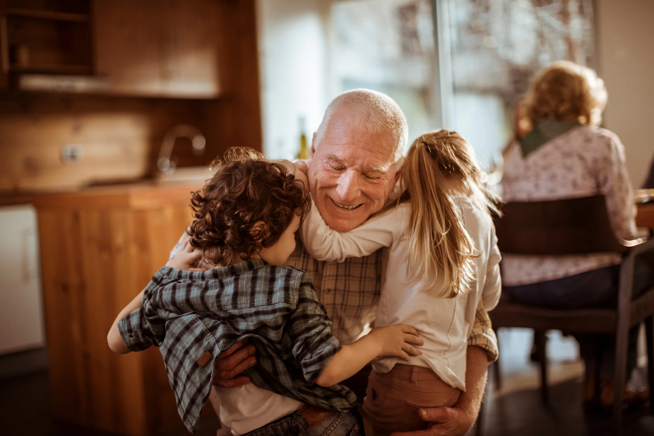 Elderly man playing with his grandchild