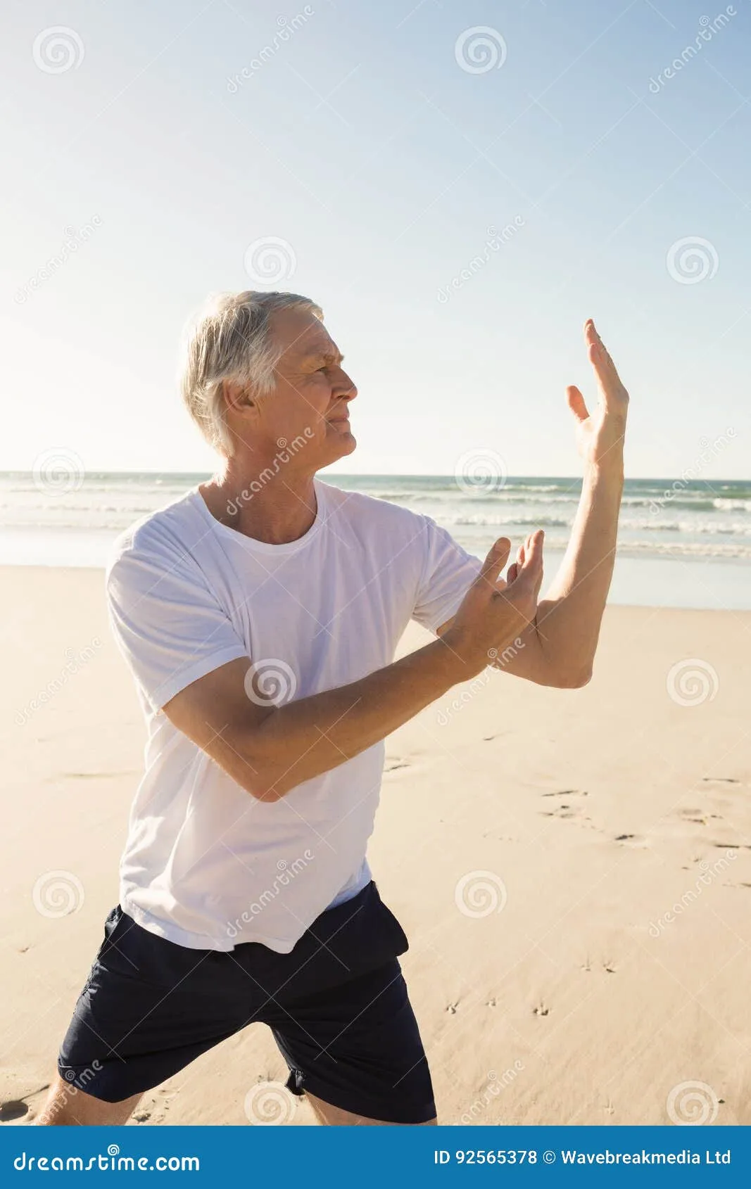 A senior man practicing yoga